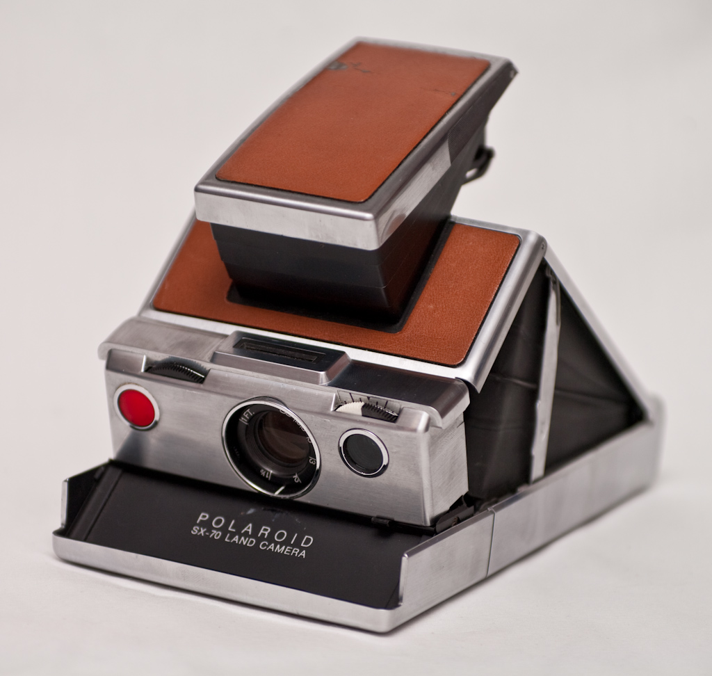 A folded Polaroid SX-70 camera